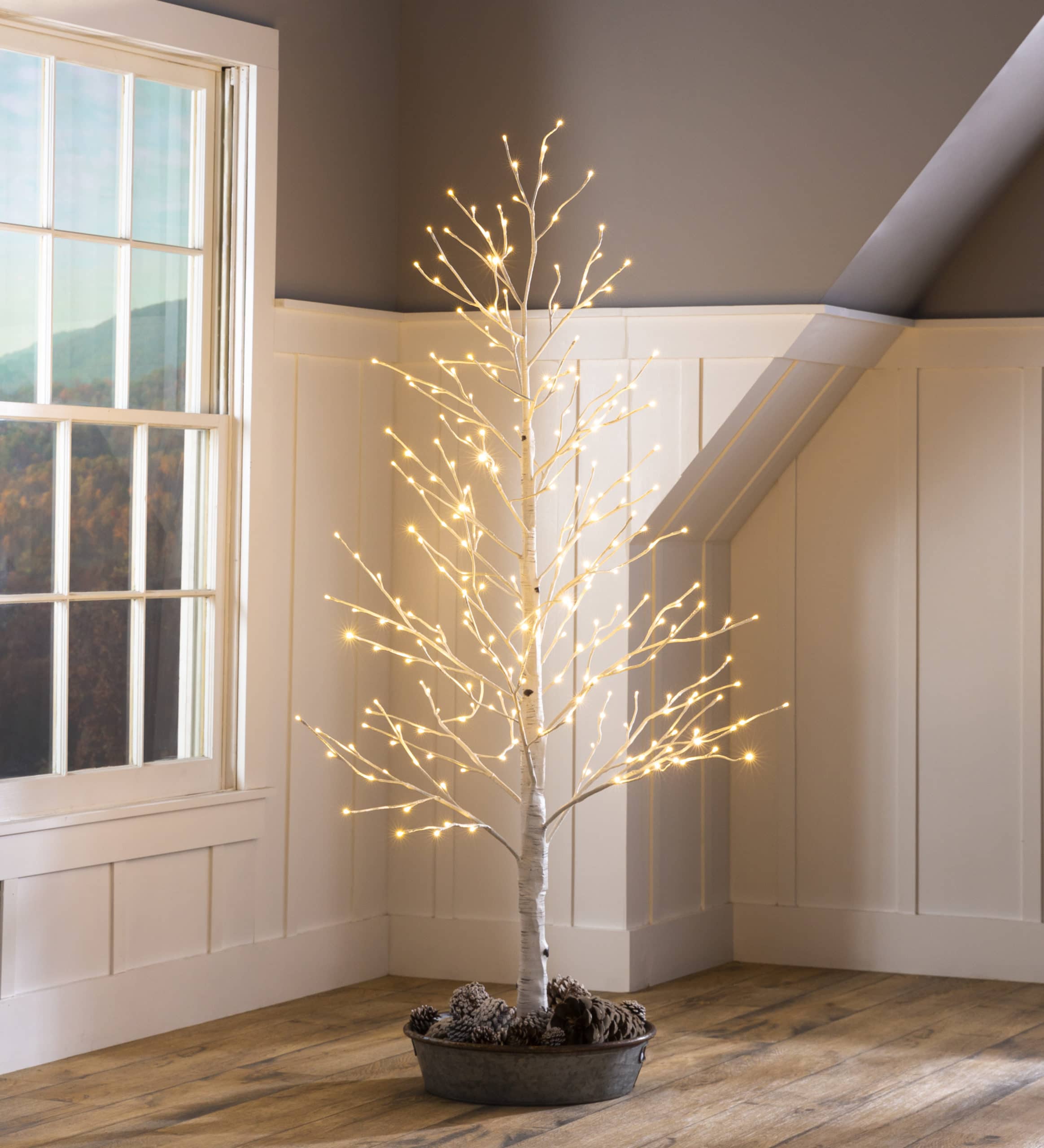 white indoor tree with lights