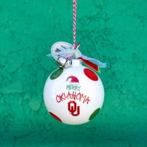 Magnolia Lane University of Oklahoma Santa Hat and Polka Dots Round Ceramic Ball 4 in cream Ornament for Christmas and Holiday decoration for Sooner fans
